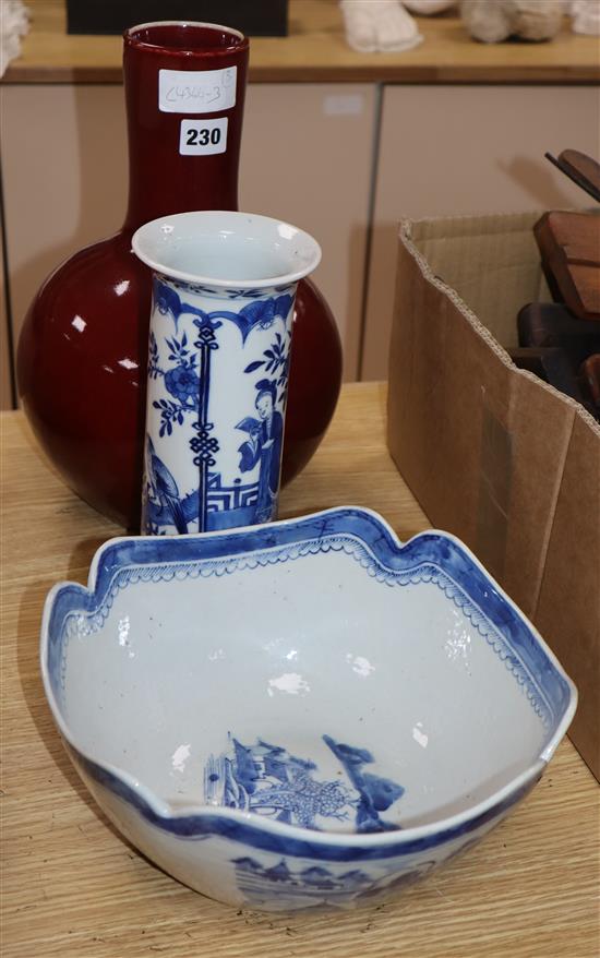 A Chinese blue and white sleeve vase, similar bowl and a sang de boeuf vase